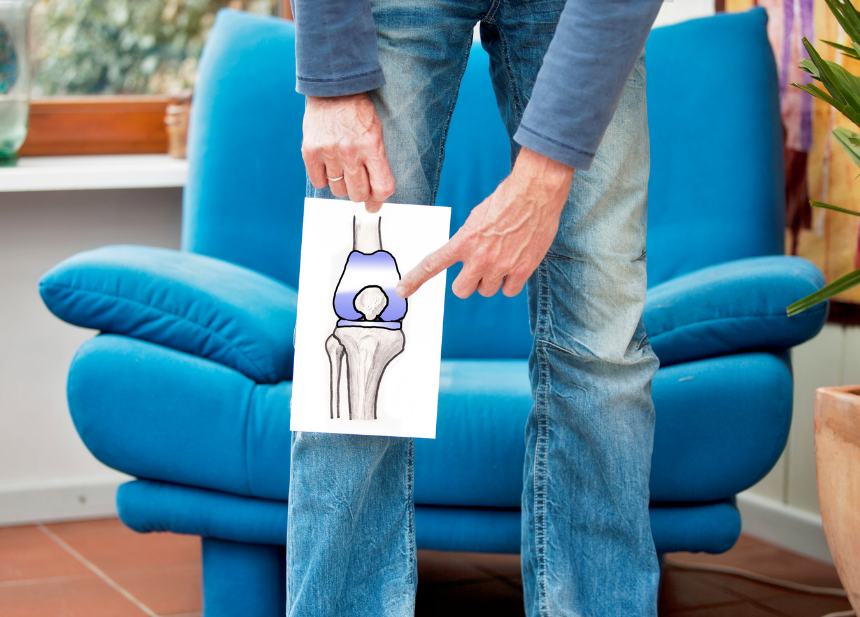 man pointing to knee joint drawing
