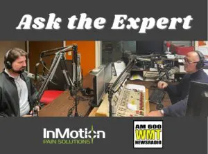 photo of Dr. Ben Wyant of InMotion Pain Solutions sitting in a radio studio being interviewed for Ask the Expert on WMT-AM