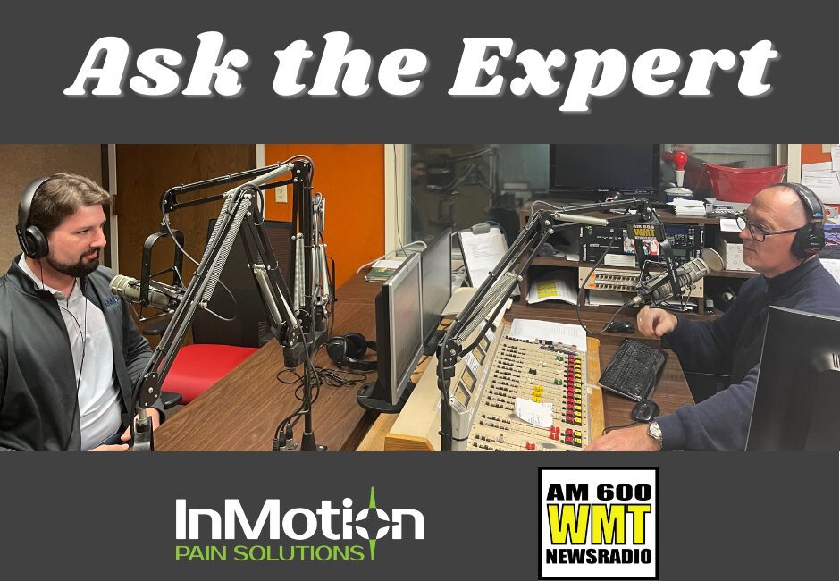 photo of Dr. Ben Wyant of InMotion Pain Solutions sitting in a radio studio being interviewed for Ask the Expert on WMT-AM